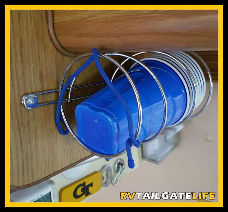 Easy Access to Solo Cups but still out of the way with this easy RV modification using a toilet paper holder in your RV kitchen
