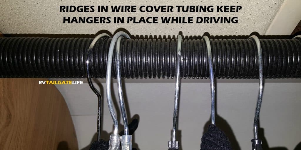Wire tubing over the closet rods helps keep hangers in place and your closet organized in your RV
