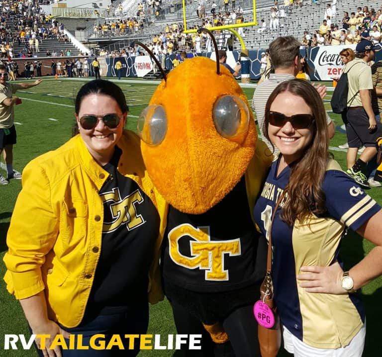 Kimberly and Amanda with Buzz on the field prior to the 2016 Homecoming game vs Duke