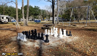 Oak Plantation RV Campground amenities include a large outdoor chess board, a playground, and disc golf
