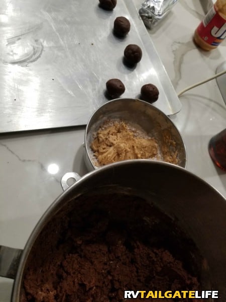 Peanut Butter filling, chocolate cookie dough, cookies balls all in the process of becoming the most decadent peanut butter chocolate cookies