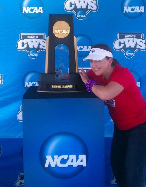 Take a picture with the College World Series championship trophy