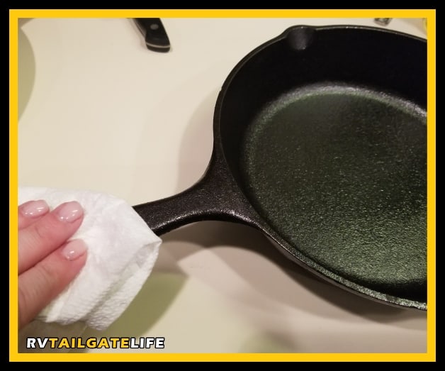 Lightly cover the entire skillet with a layer of vegetable oil to season it