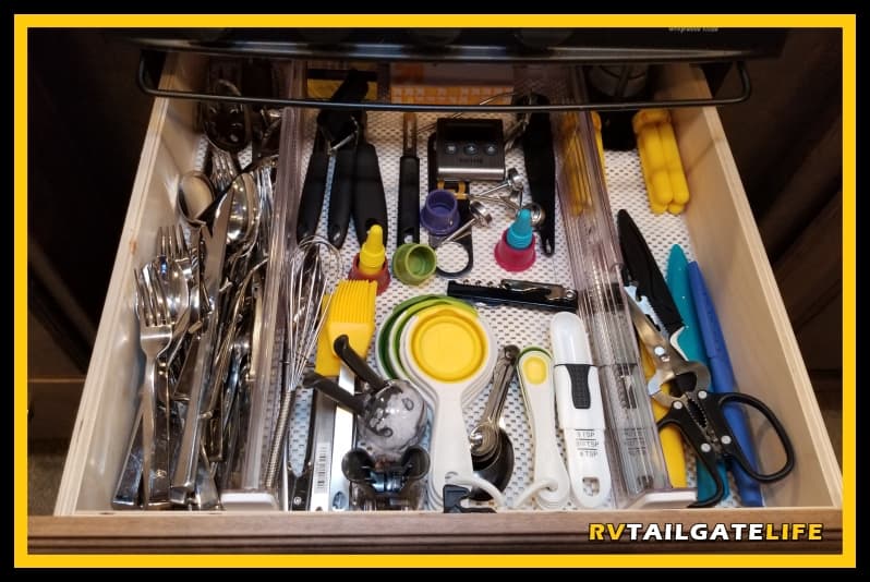 Keep your RV kitchen drawers organized with non slip kitchen shelf liner and expandable organizers.