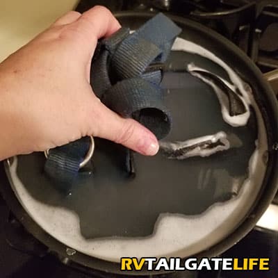 Adding the dog harness to the Castile Soap wash