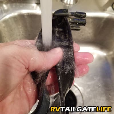 Pre-rinse the dog collar or harness before adding to the wash