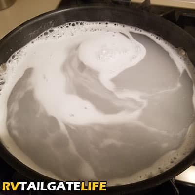Castile soap, baking soda, and hot water will look cloudy