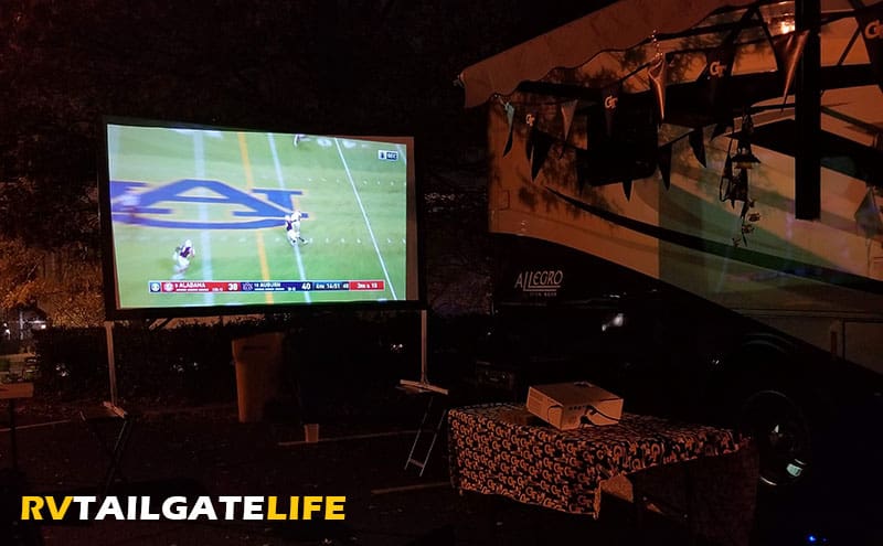 Project the game on a large screen at night for large crowds to watch. Use the ESPN smartphone app to stream football games during the tailgate or the Winegard app to find OTA or satellite signals