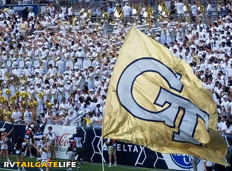 Georgia Tech Marching Band with the Georgia Tech GT gold flag at a home GT football game