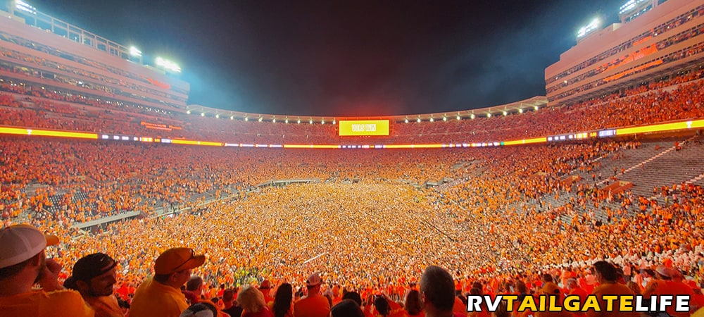 It is a sea of orange as Tennessee fans storm the field and tear down the goal posts after the 52-49 win over Alabama on the Third Saturday in October