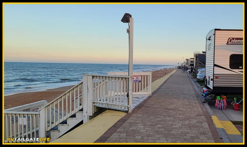 Boardwalk between the RVs and the beach during the early evening sunset